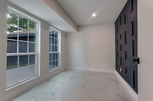 a view of empty room with windows