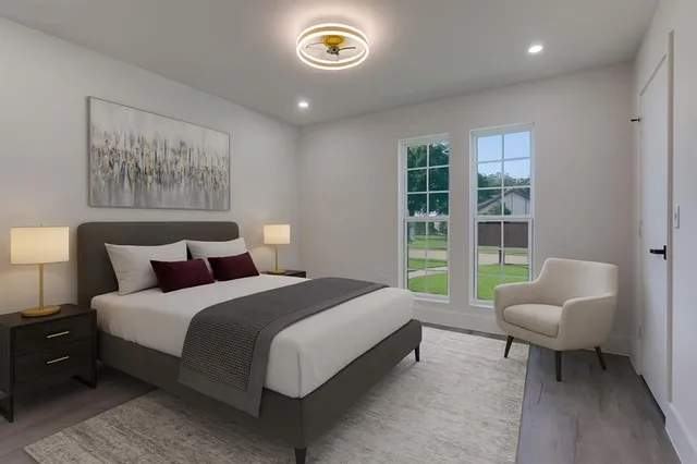 a spacious bedroom with a bed and a couch