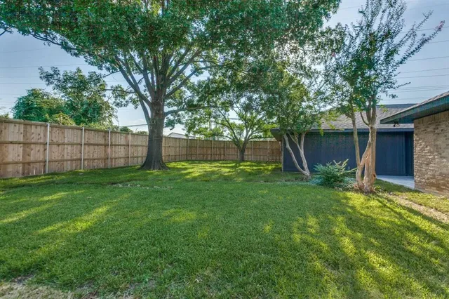 a view of a backyard with a garden