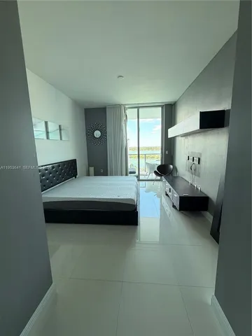 a bathroom with a double vanity sink and mirror