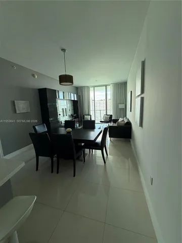 a kitchen with a sink appliances and cabinets