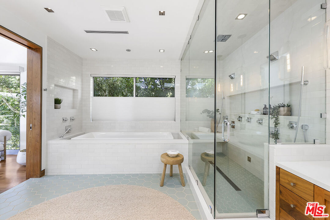 612 East Channel Road Santa Monica, CA 90402 - Photo 15 of 72 a bathroom with a bathtub and a shower