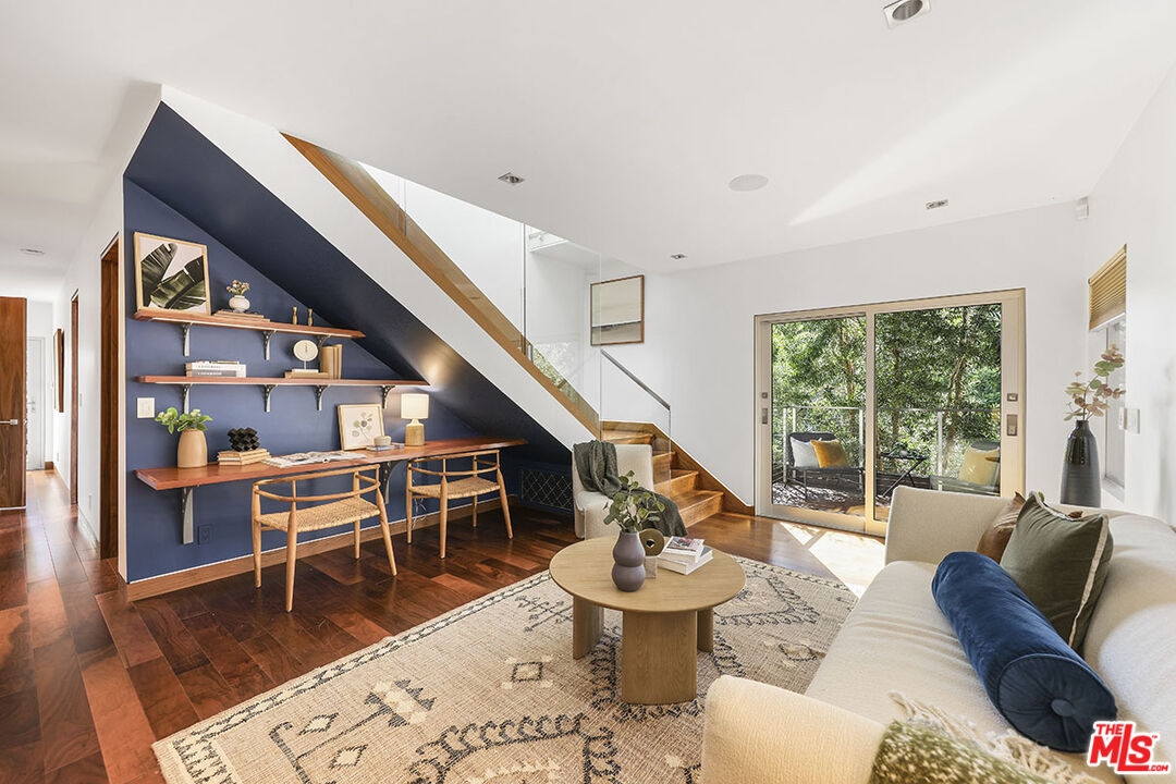 612 East Channel Road Santa Monica, CA 90402 - Photo 21 of 72 a living room with furniture a rug and a large window