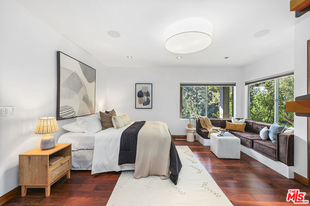 612 East Channel Road Santa Monica, CA 90402 - Photo 23 of 72 a living room with furniture and a large window