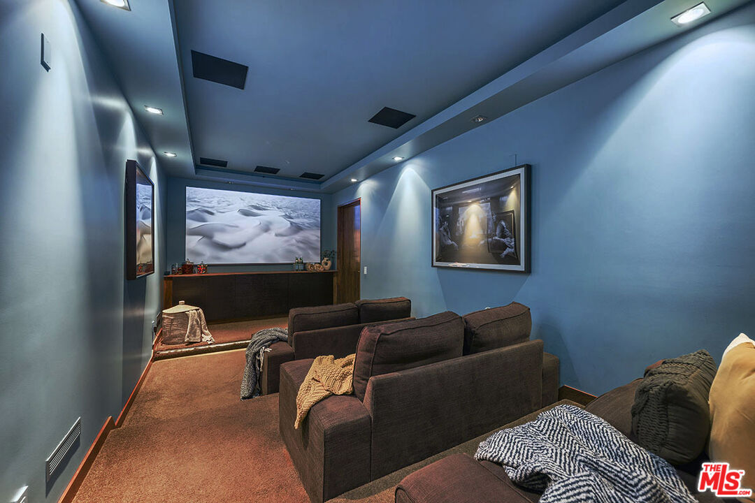 612 East Channel Road Santa Monica, CA 90402 - Photo 27 of 72 a media room with lots of chairs and a projector screen