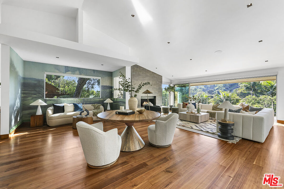 612 East Channel Road Santa Monica, CA 90402 - Photo 3 of 72 a living room with fireplace furniture and a large window