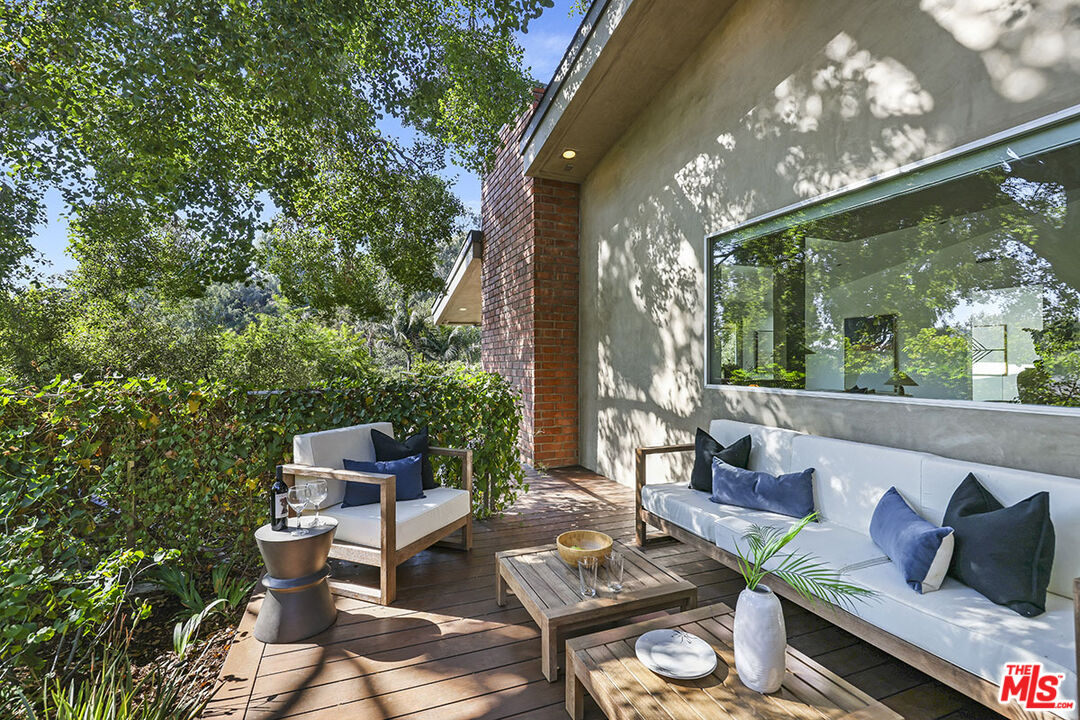 612 East Channel Road Santa Monica, CA 90402 - Photo 34 of 72 a outdoor living space with furniture and garden view