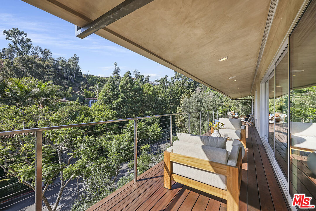 612 East Channel Road Santa Monica, CA 90402 - Photo 36 of 72 a view of a balcony with wooden floor and iron fence