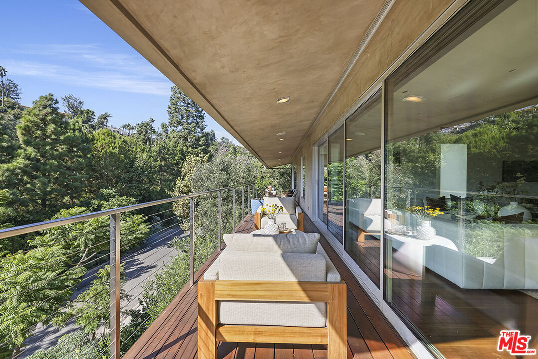 612 East Channel Road Santa Monica, CA 90402 - Photo 37 of 72 a view of a balcony with chairs and wooden floor