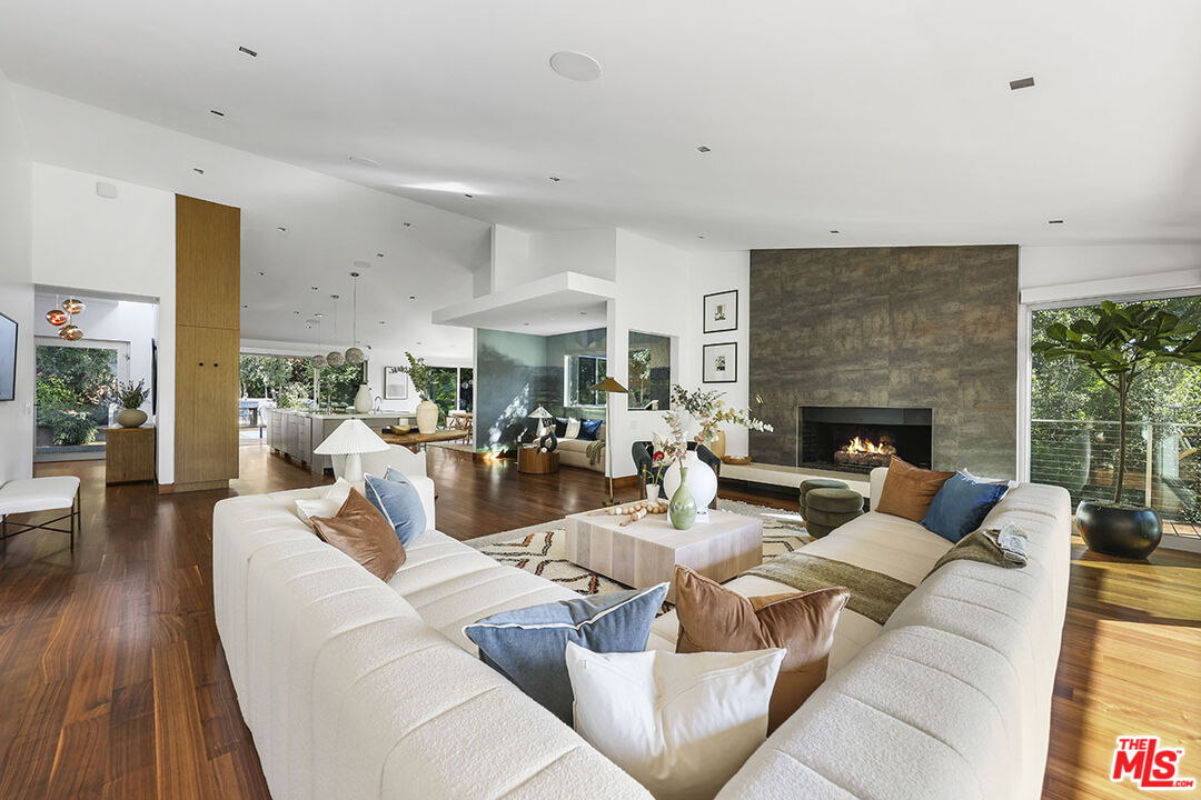 612 East Channel Road Santa Monica, CA 90402 - Photo 4 of 72 a living room with furniture potted plant and a fireplace