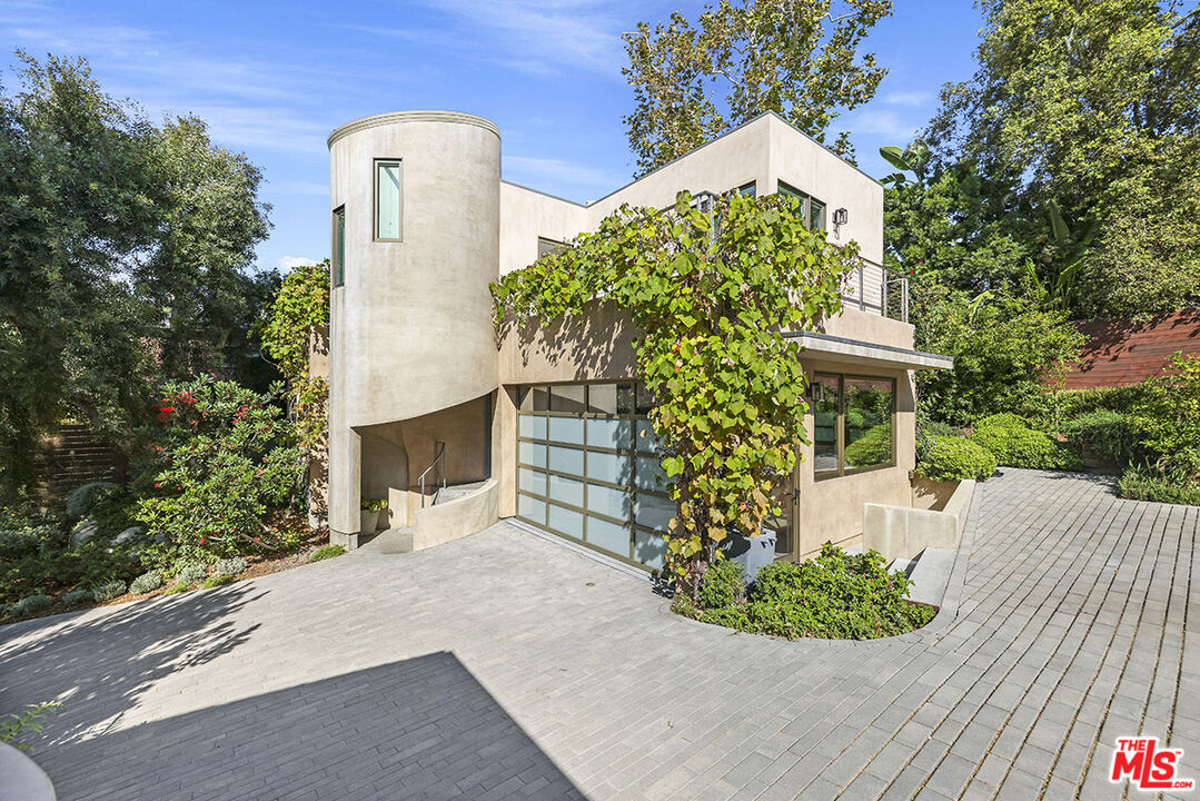 612 East Channel Road Santa Monica, CA 90402 - Photo 48 of 72 a front view of a house with a yard and garage