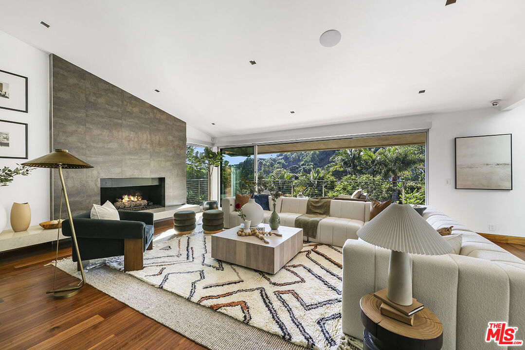 612 East Channel Road Santa Monica, CA 90402 - Photo 5 of 72 a living room with furniture and a fireplace