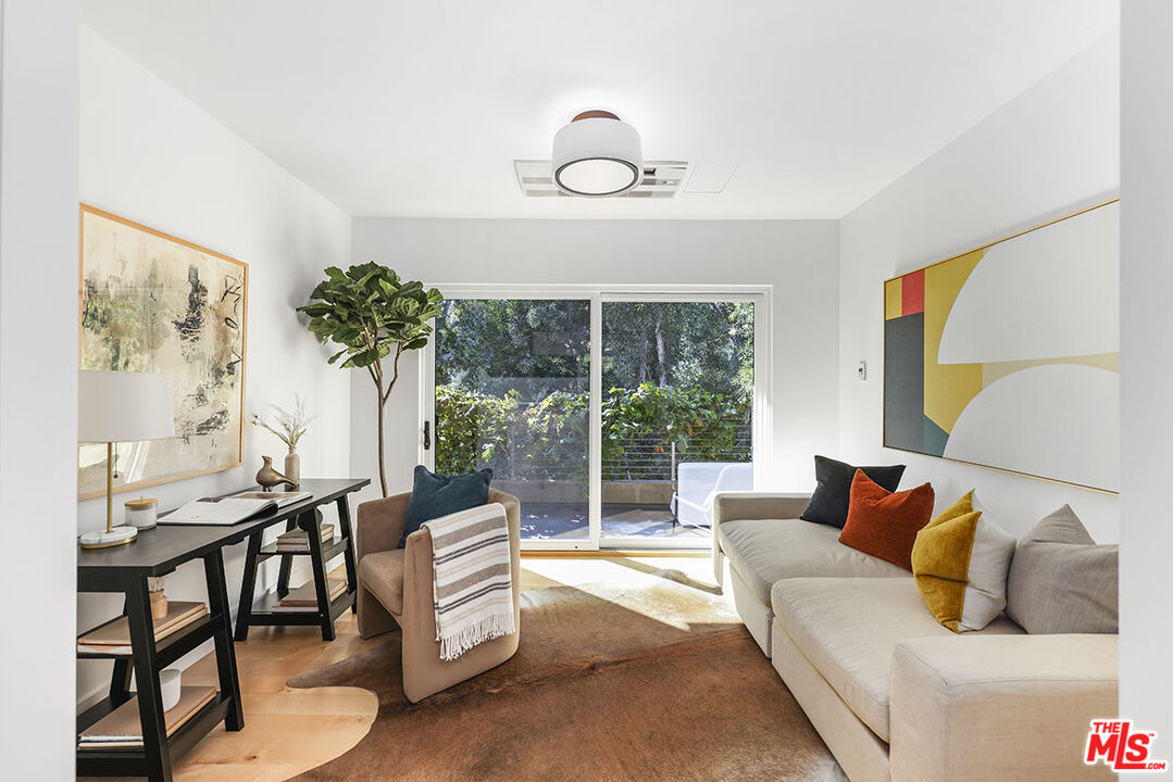 612 East Channel Road Santa Monica, CA 90402 - Photo 58 of 72 a living room with furniture and a large window
