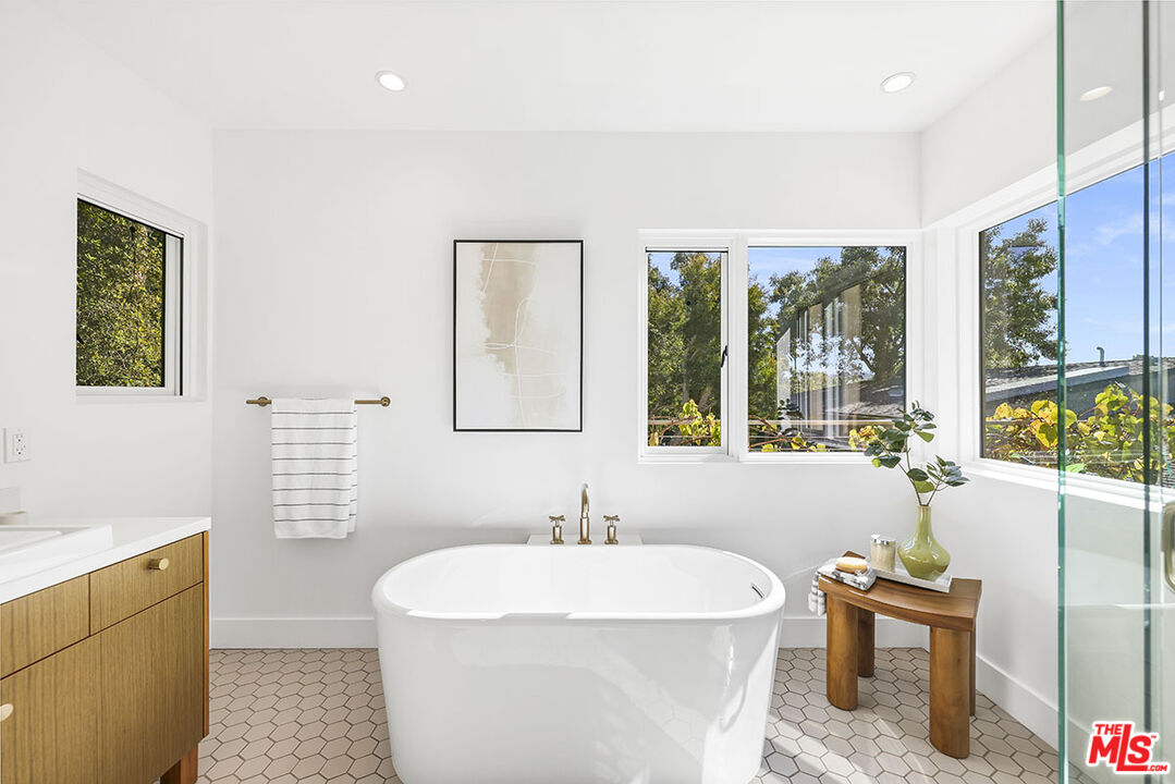 612 East Channel Road Santa Monica, CA 90402 - Photo 60 of 72 a bathroom with a sink a bathtub and next to a window