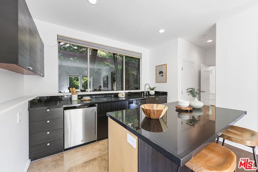 612 East Channel Road Santa Monica, CA 90402 - Photo 66 of 72 a kitchen with counter space sink stove and cabinets