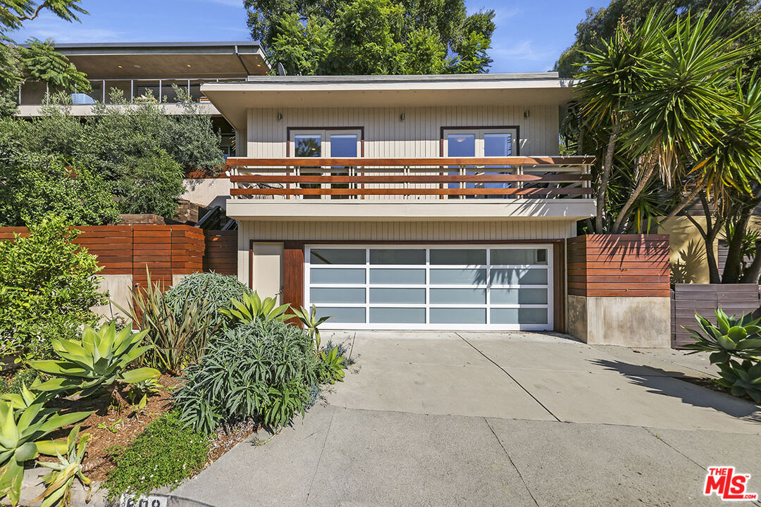 612 East Channel Road Santa Monica, CA 90402 - Photo 72 of 72 front view of a house with a yard and potted plants