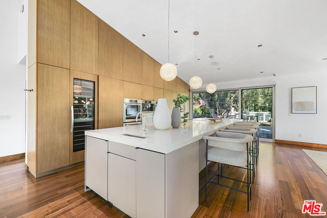 612 East Channel Road Santa Monica, CA 90402 - Photo 9 of 72 a kitchen with a sink cabinets and wooden floor