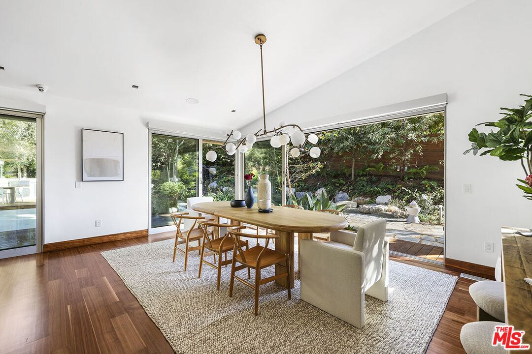 612 East Channel Road Santa Monica, CA 90402 - Photo 10 of 72 a view of a dining room with furniture window and wooden floor