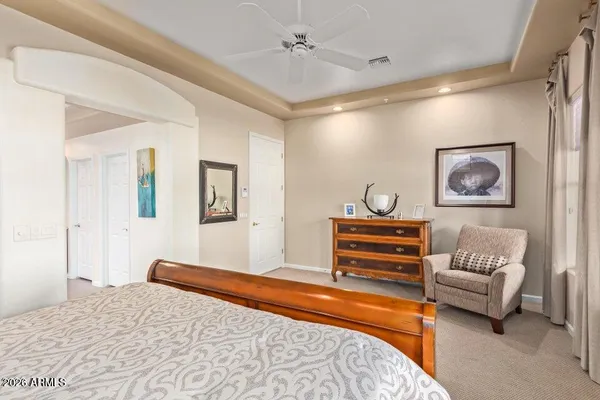 a spacious bathroom with a granite countertop sink a toilet and shower