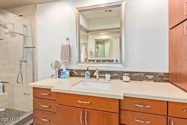 a spacious bedroom with a bed and a window