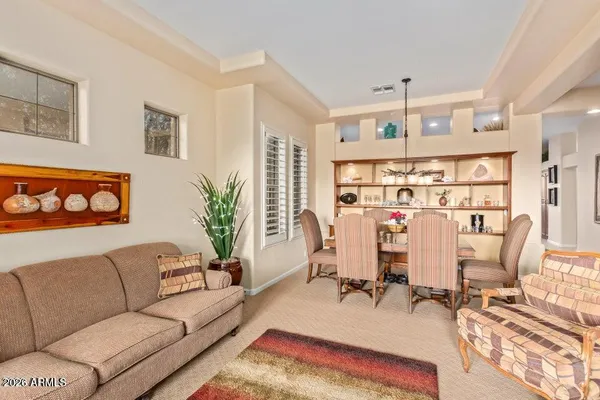 a living room with furniture and a window