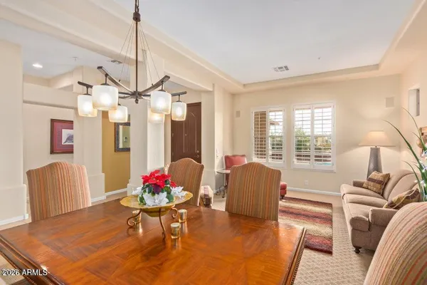 a dining room with furniture and window