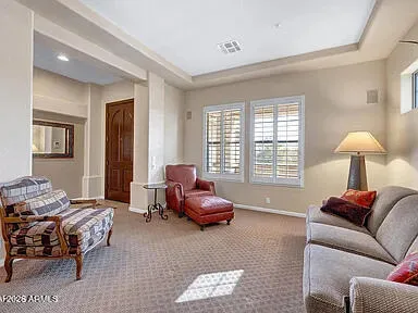 a dining hall with stainless steel appliances granite countertop a dining table and chairs with wooden floor
