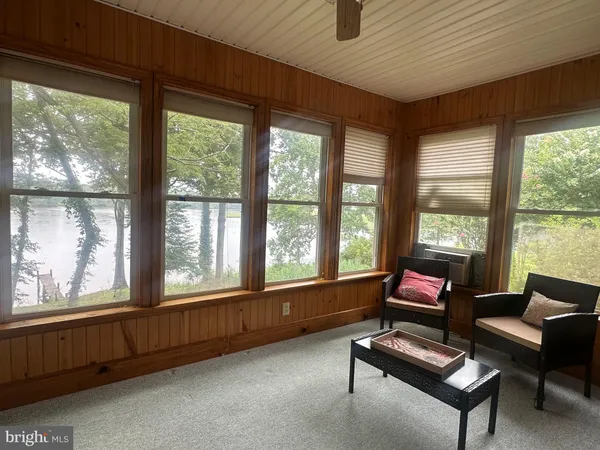 a living room with furniture and windows