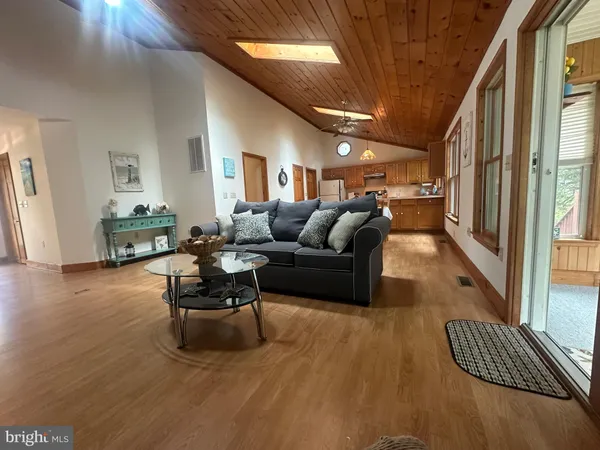 a living room with furniture rug and a large window