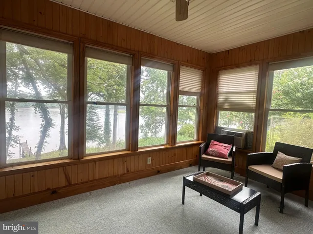 a living room with furniture and windows