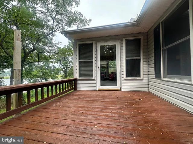 a view of a balcony with wooden floor