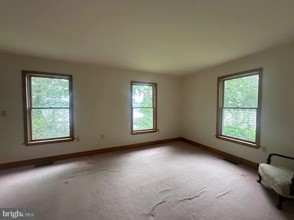 an empty room with windows