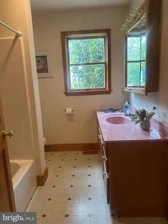 a dining room with a table and a window