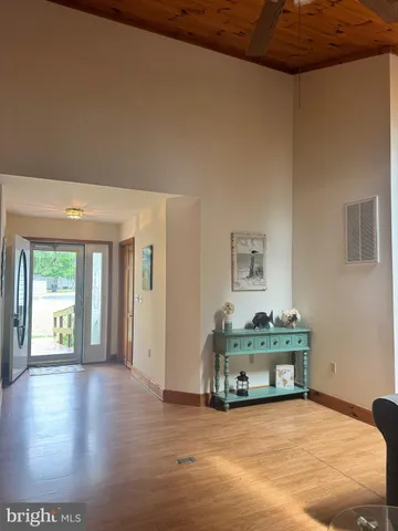 a view of an empty room with a window