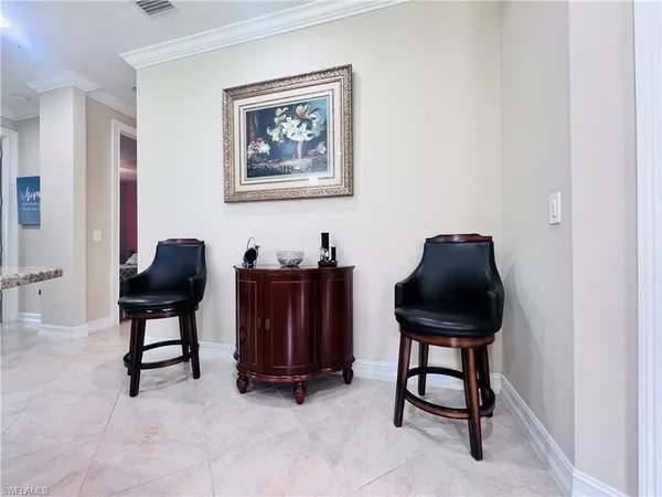 a living room with furniture and a chair