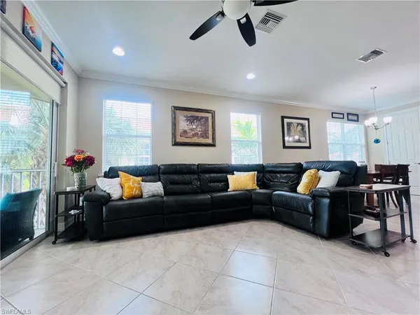 a living room with furniture and a window