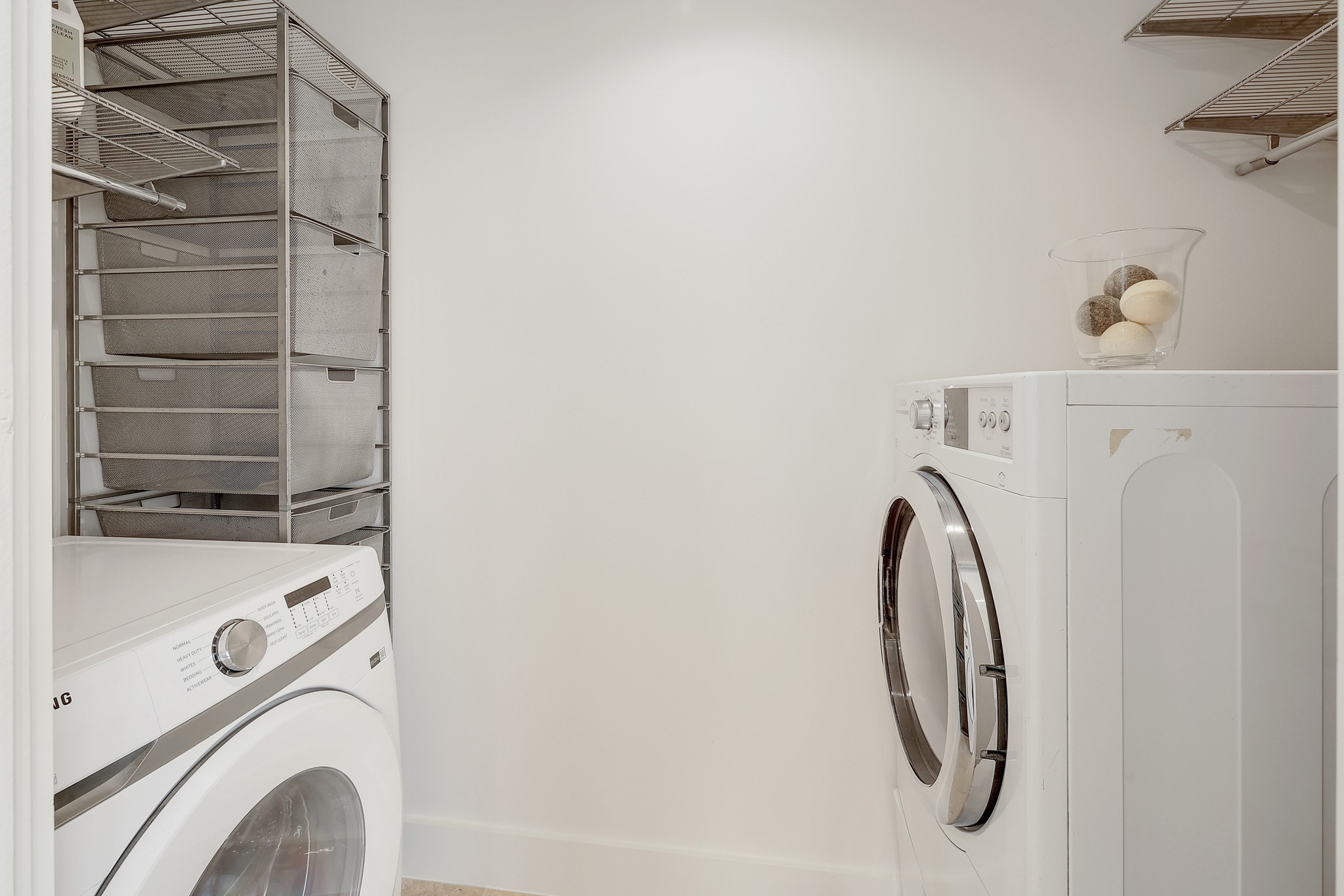 7705 Jester Boulevard Austin, TX 78730 - Photo 18 of 36 A well-organized laundry area offers practical storage and modern appliances.