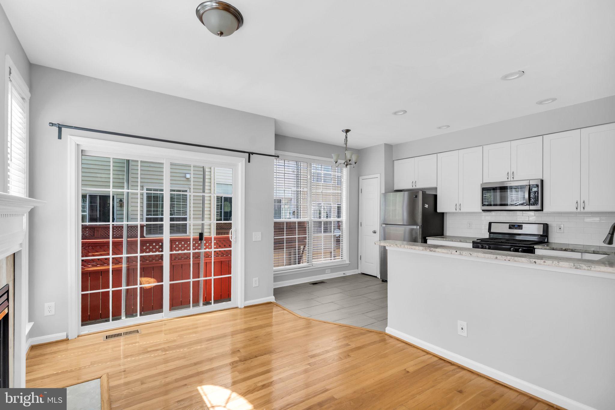 6013 Riddle Walk Alexandria, VA 22312 - Photo 12 of 31 a view of a kitchen with center island and stainless steel appliances
