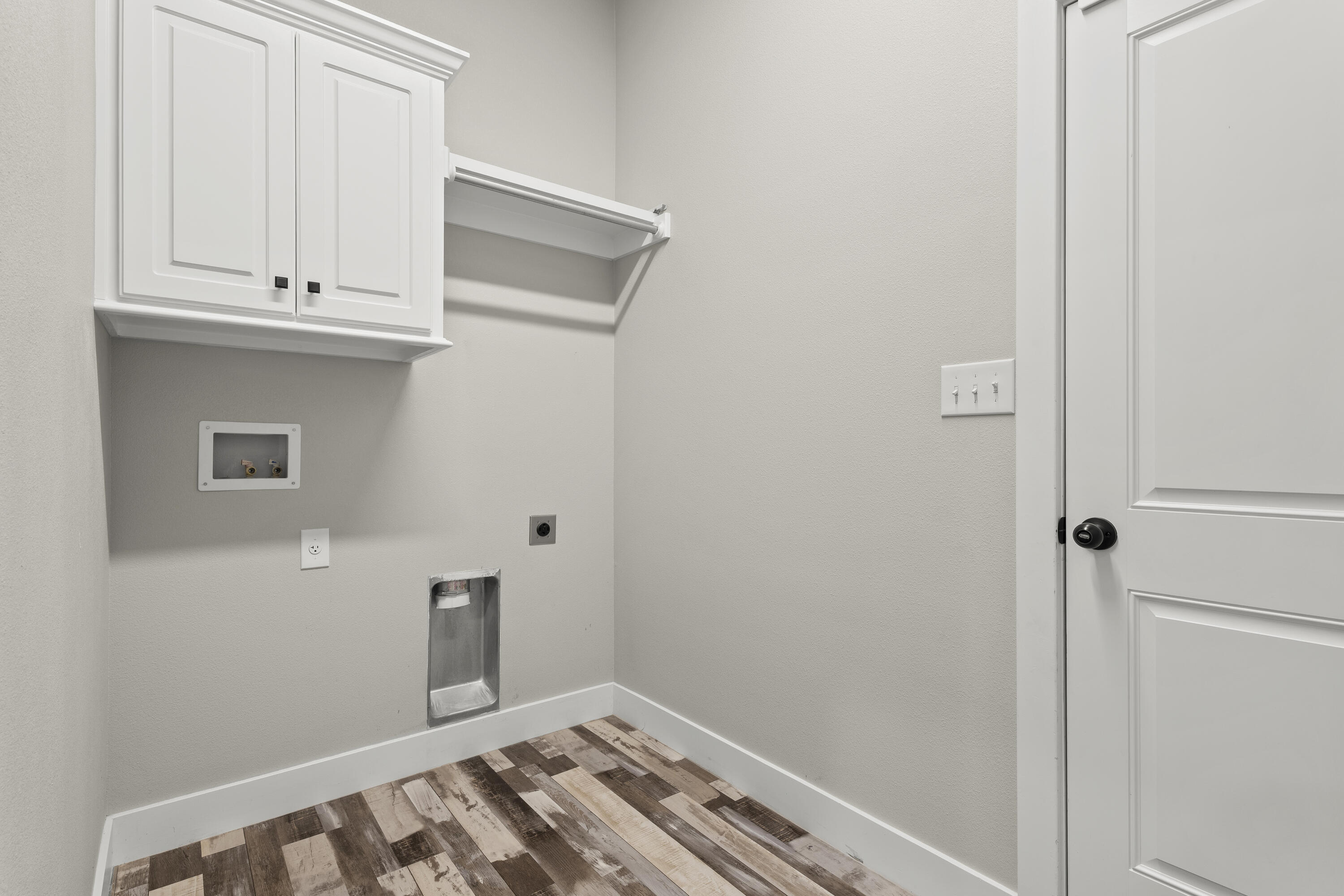7605 58th Street Lubbock, TX 79407 - Photo 18 of 19 a view of kitchen and utility room
