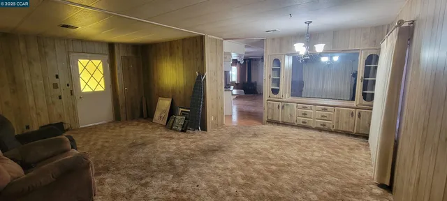 a large room with windows and pillars in it