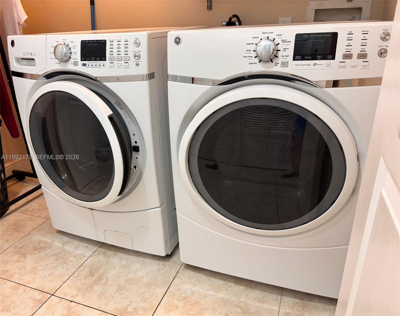 5820 Southwest 113th Court Miami, FL 33173 - Photo 20 of 22 a utility room with dryer and washer