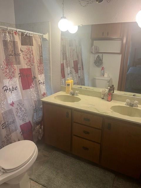 915 Highway 84 Mullin, TX 76864 - Photo 15 of 37 a bathroom with a sink toilet and shower