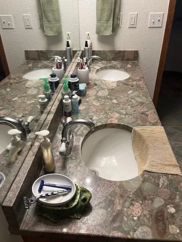 a bathroom with a bathtub and shower