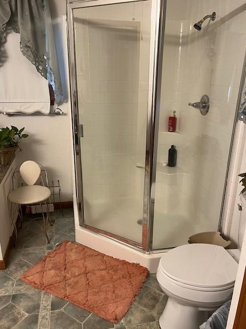 915 Highway 84 Mullin, TX 76864 - Photo 22 of 37 a bathroom with a toilet and a shower