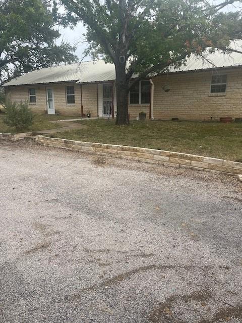 915 Highway 84 Mullin, TX 76864 - Photo 3 of 37 a front view of a house with a yard