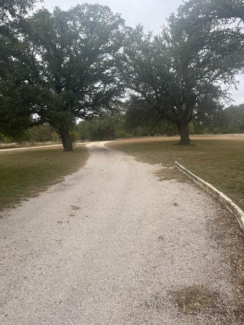 915 Highway 84 Mullin, TX 76864 - Photo 5 of 37 a view of dirt field with trees in background
