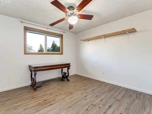 a bedroom with bed and a window