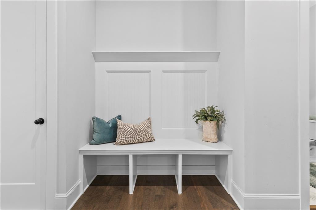 120 Meadow Mill Road Woodstock, GA 30188 - Photo 13 of 56 a table that has a table and a chair with wooden floor