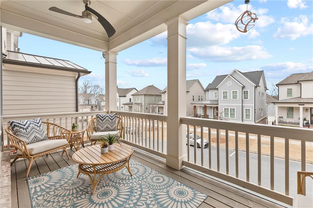 120 Meadow Mill Road Woodstock, GA 30188 - Photo 14 of 56 a view of a balcony with chairs