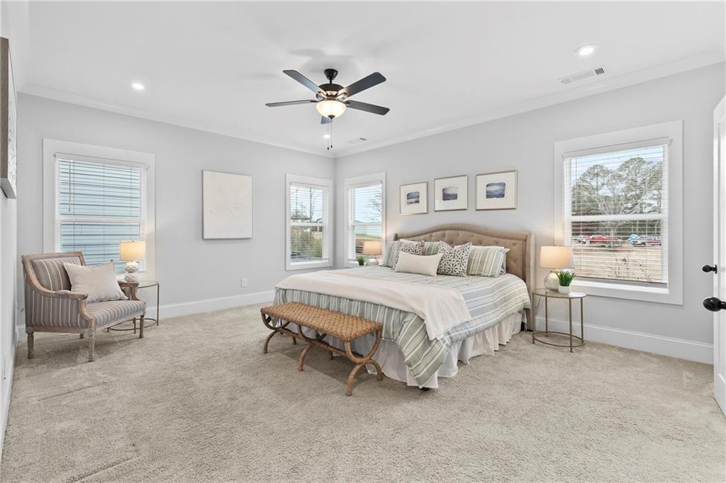 120 Meadow Mill Road Woodstock, GA 30188 - Photo 19 of 56 a spacious bedroom with a bed and a window